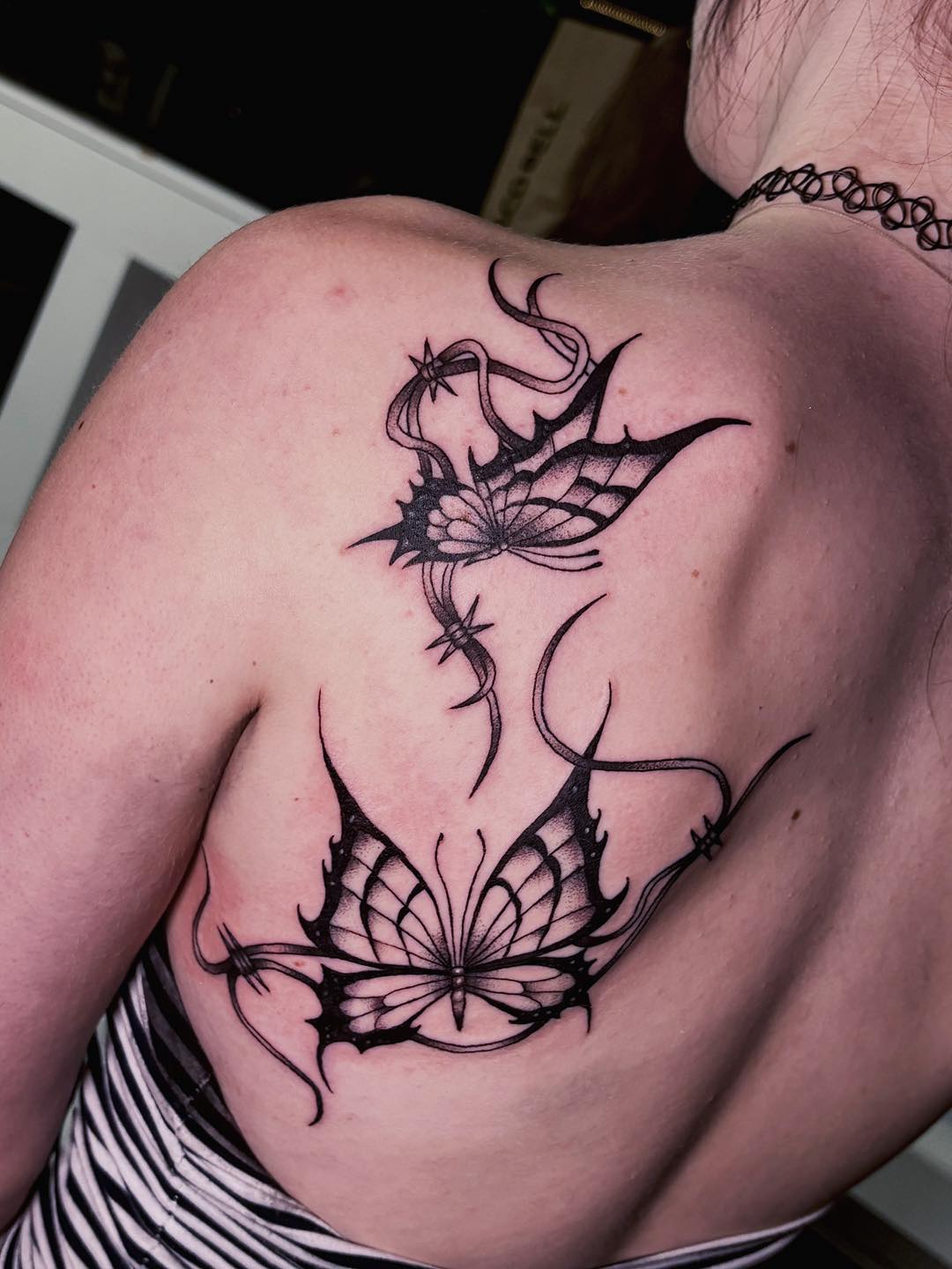 butterfly tattoo inked under ground